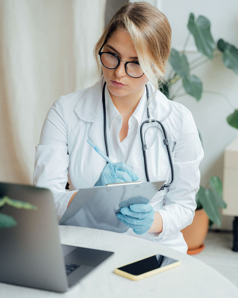 Female doctor reviewing patient notes during Cardio-HART for Physicians test in primary care