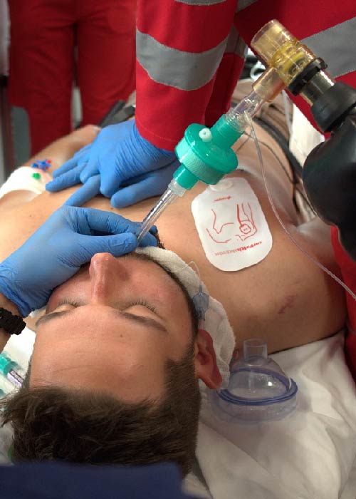 Doctor performing emergency cardiac triage on patient in hospital setting
