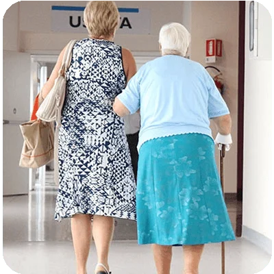 Cardiology patient – Cardio-HART Elderly cardiology patient walking with caregiver